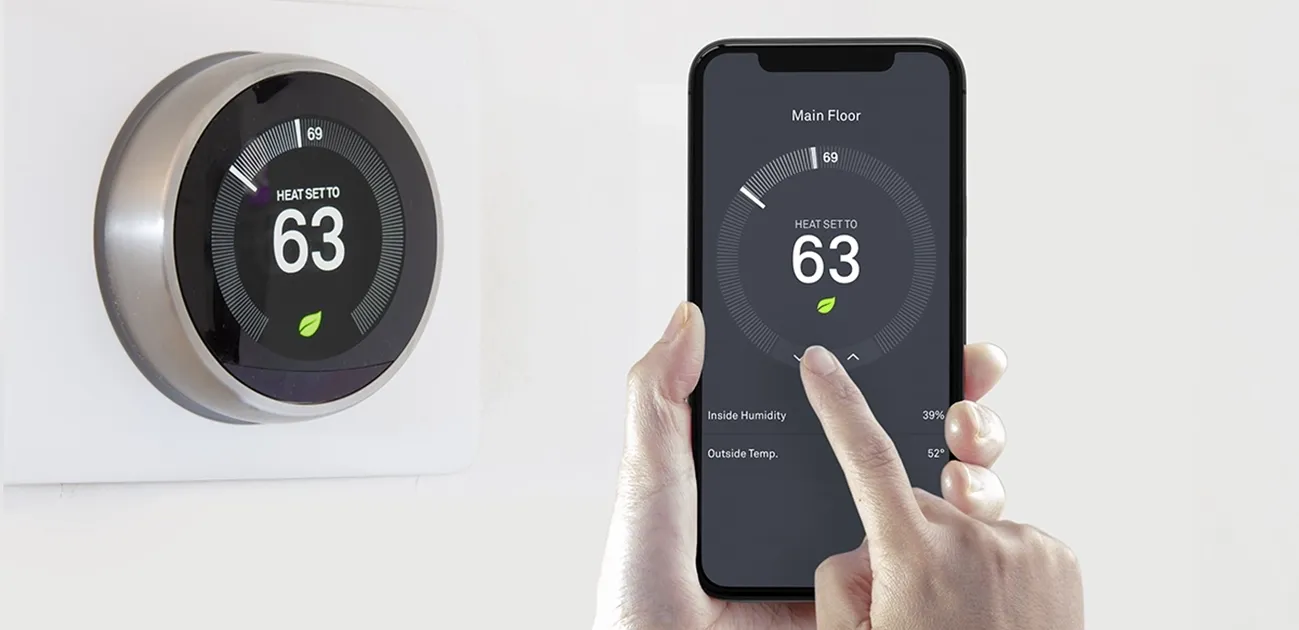 A person using a smart phone application saving energy with a wireless smart thermostat on a white background.